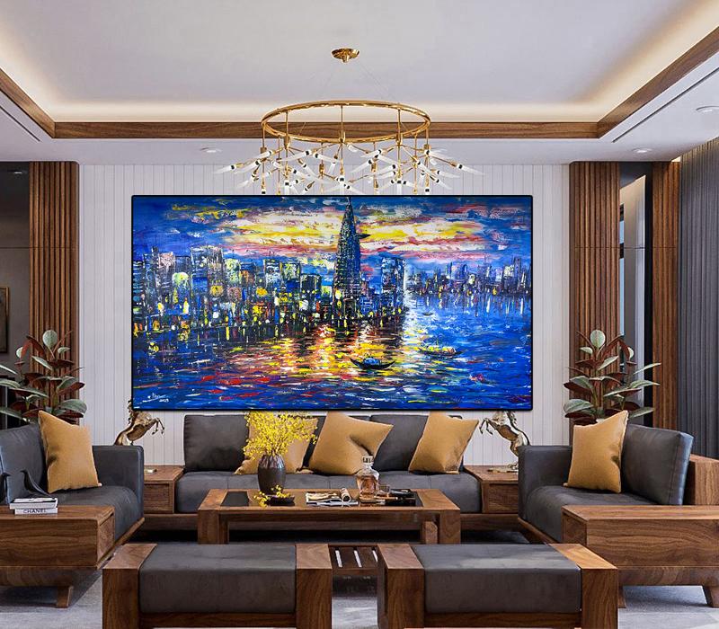 Tranh khổ lớn với gam màu tương phản mạnh làm điểm nhấn ấn tượng cho không gian phòng khách biệt thự hiện đại